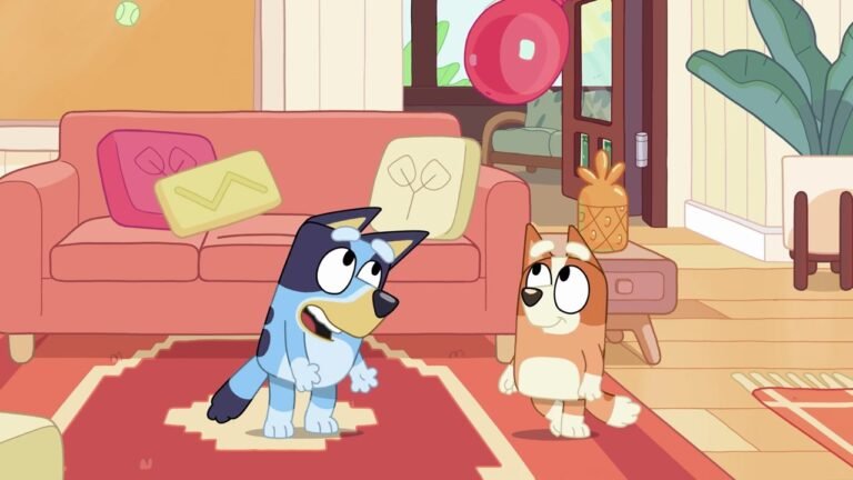 Bluey and Bingo in the living room during the 'Keepy Uppy' episode, Bluey mid-motion with wide eyes, Bingo watching attentively, a tennis ball floating above them, pink couch and red rug in background.